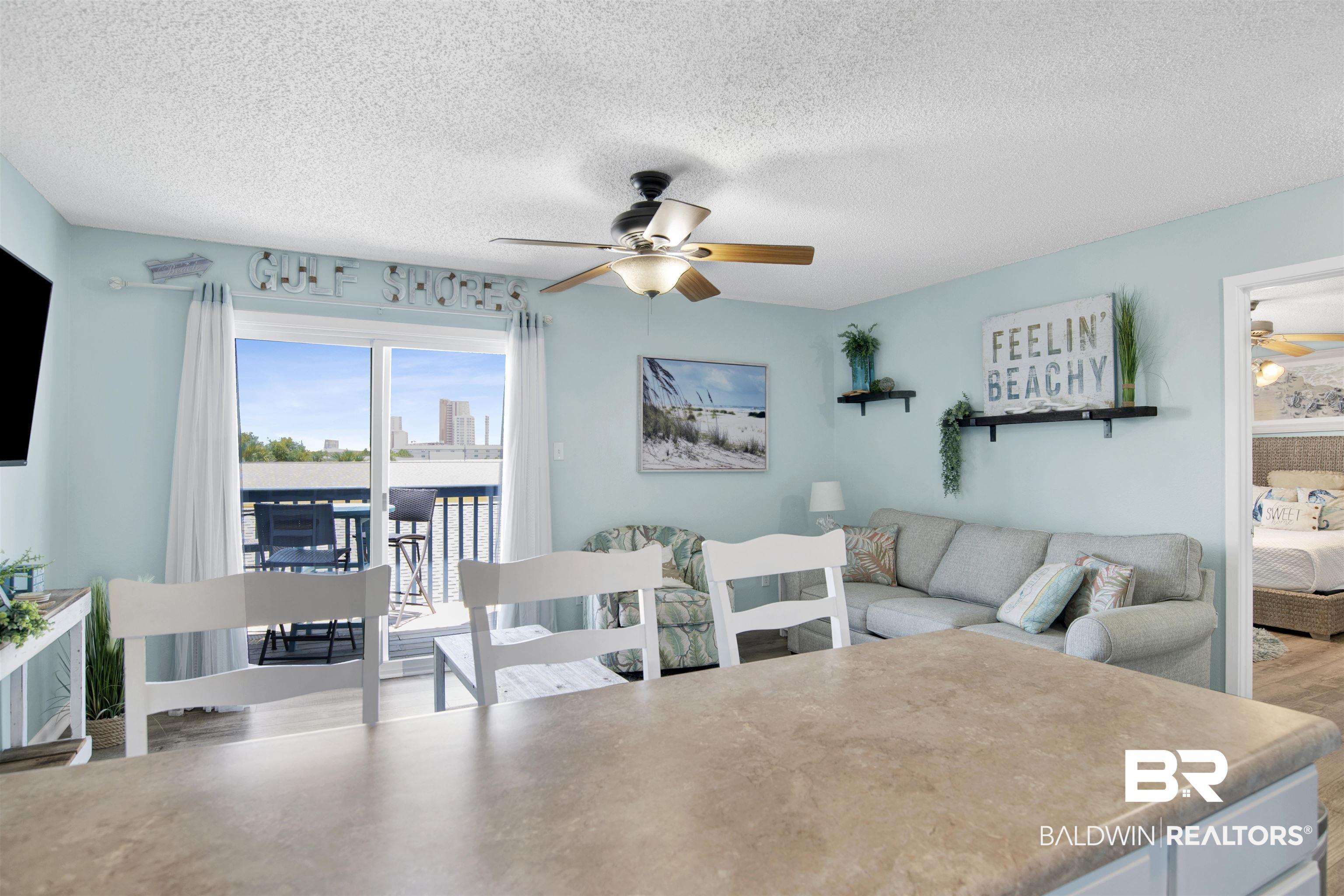 Image 4: Dining room with a ceiling fan, a textured ceiling, and wood finished floors