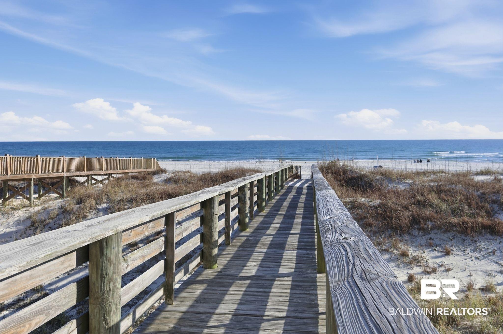 Image 3: View of home's community featuring view of water and beach