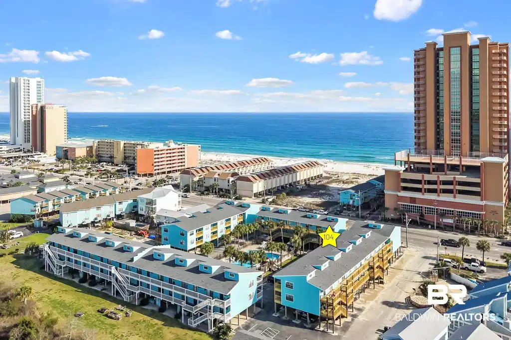 Image 1: View of urban area with waterfront with a beach