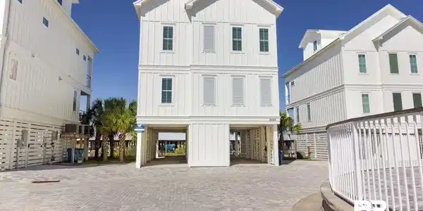 Image 4: Stilted coastal-style architecture featuring board and batten siding