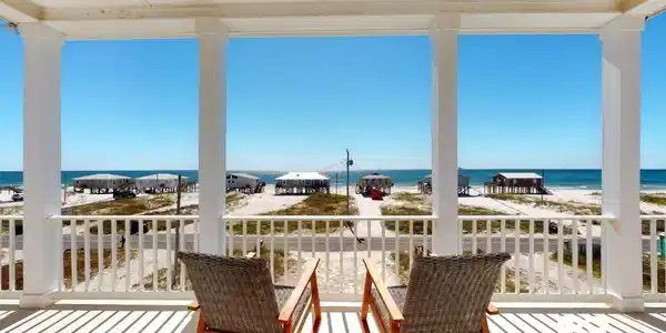 Image 3: Balcony featuring view of water and beach