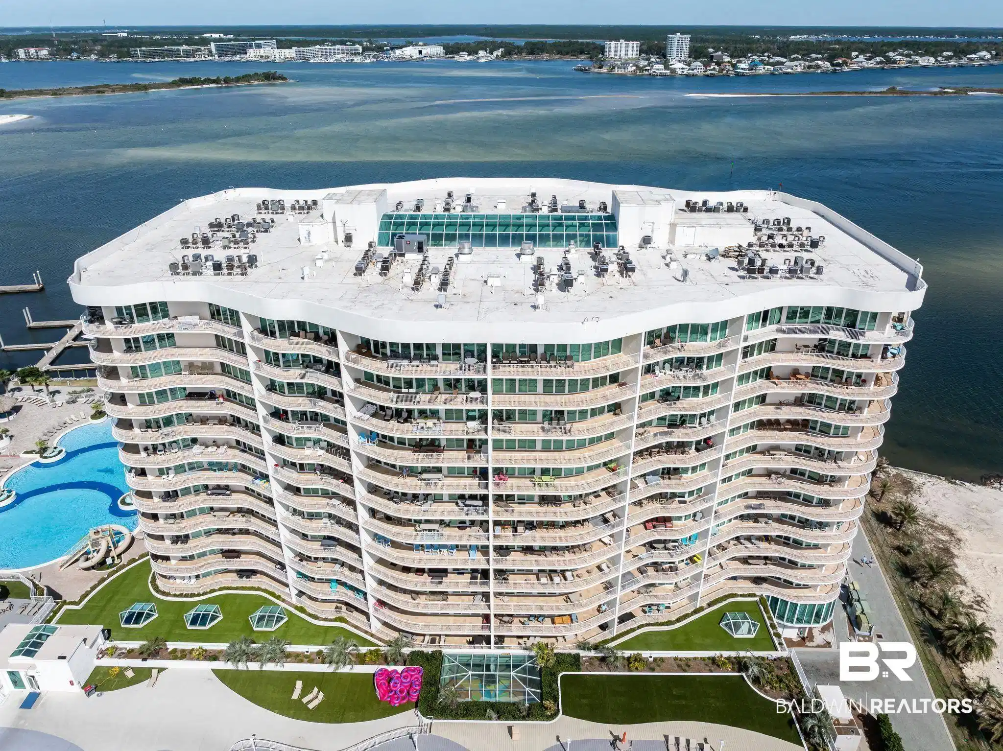 Image 1: Bird's eye view with a water view