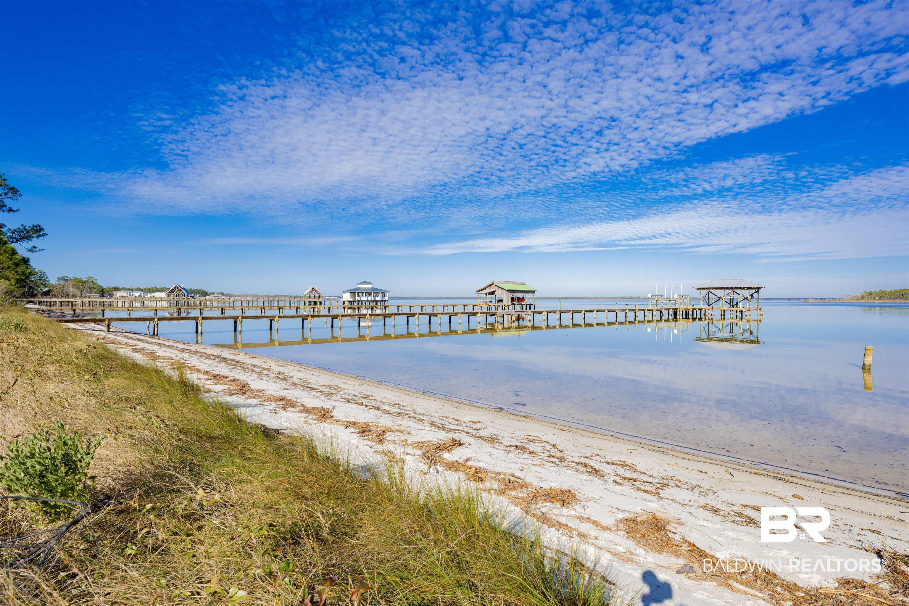 Image 3: Dock featuring a water view and a pier