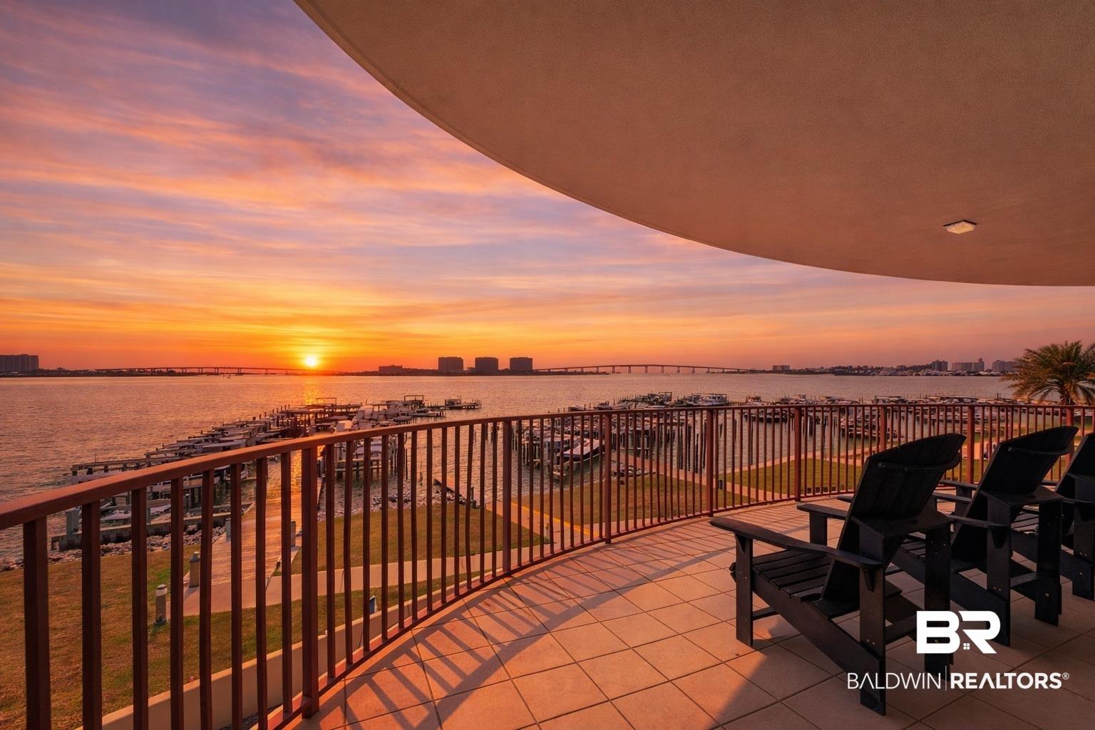 Image 2: Balcony featuring a water view