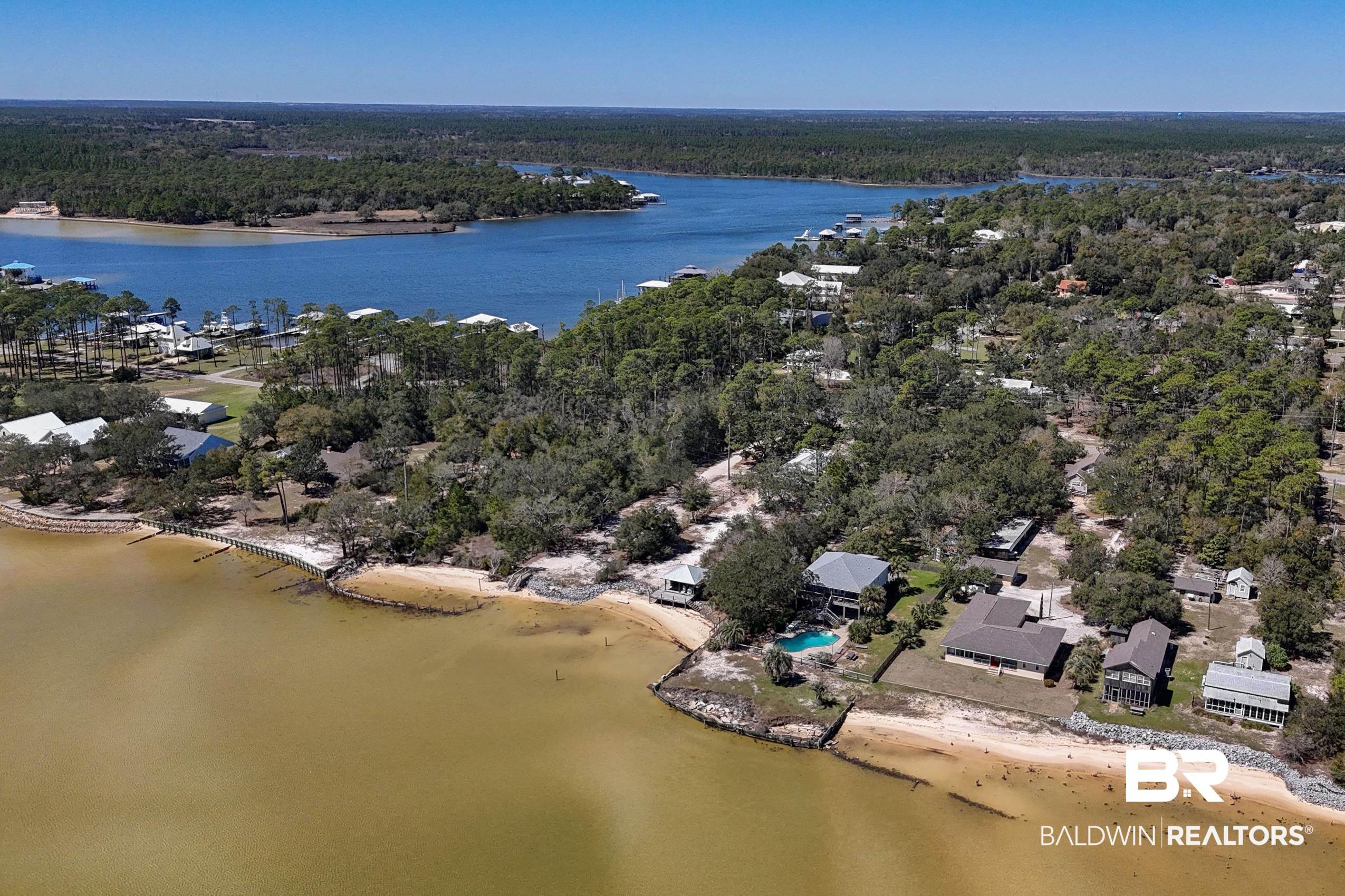 Image 2: Drone / aerial view featuring a water view and a wooded view
