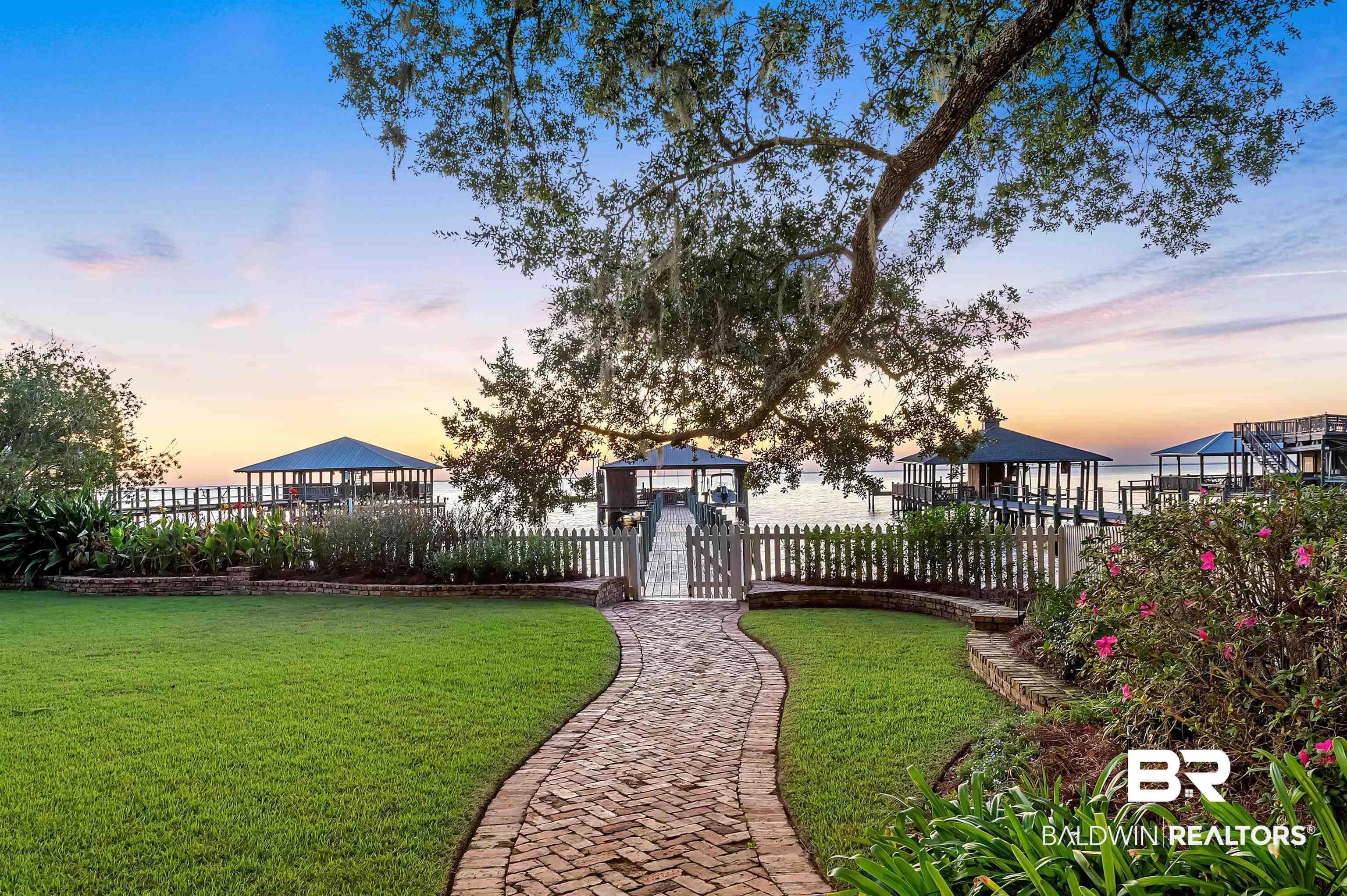 Image 4: Yard at dusk with a gate