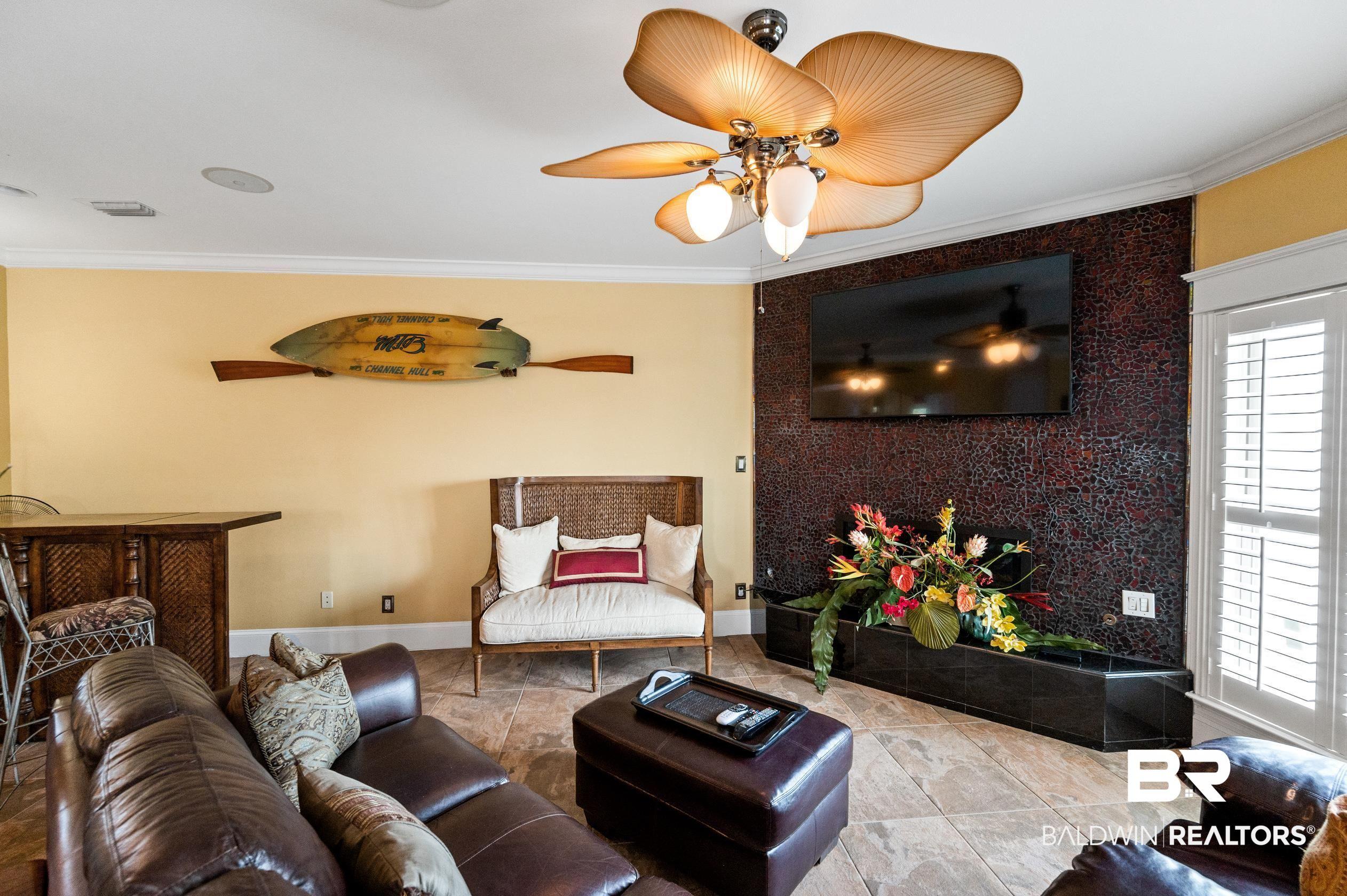 Image 3: Living room featuring crown molding and ceiling fan