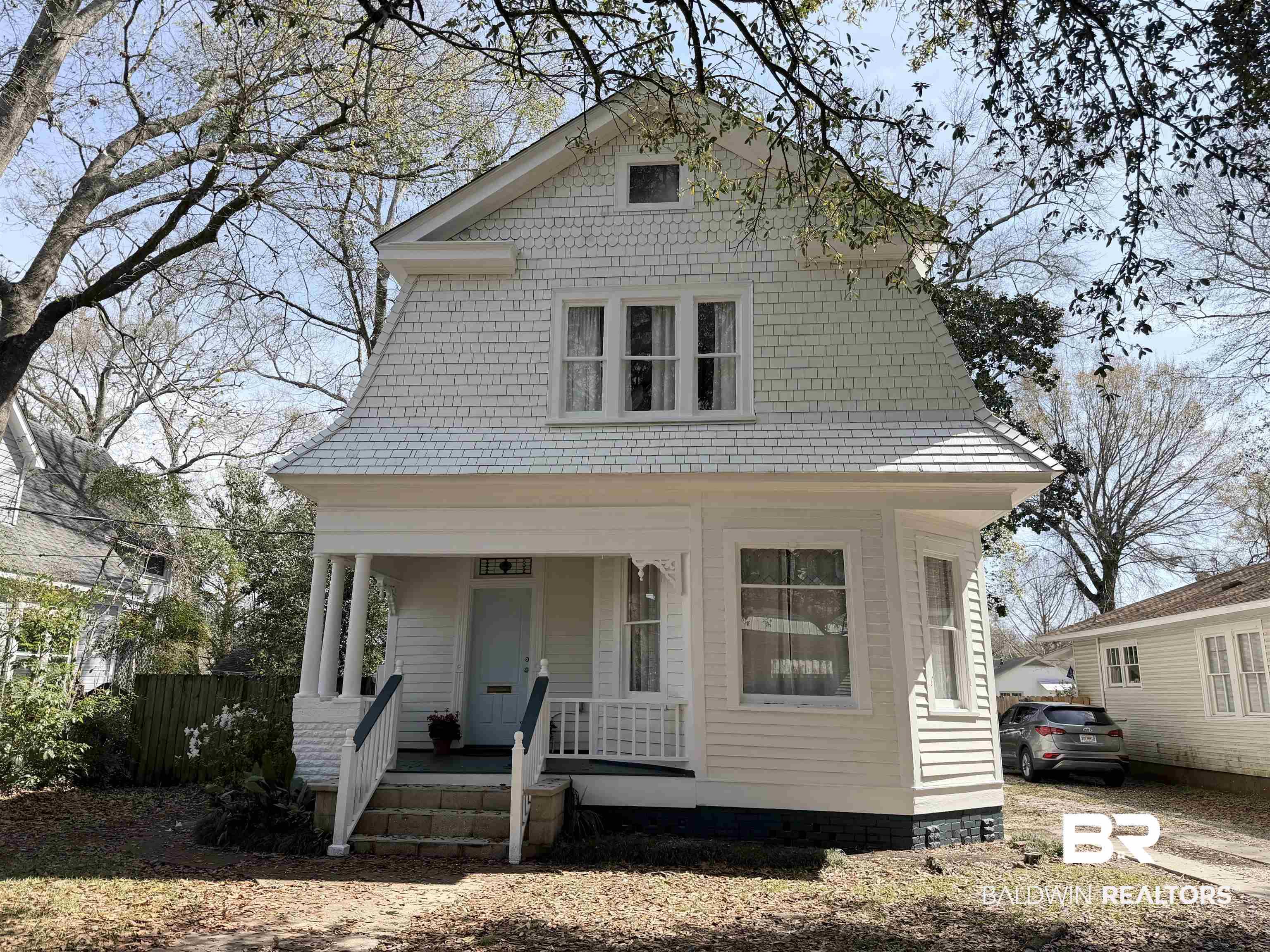 Image 1: View of front of property with covered porch