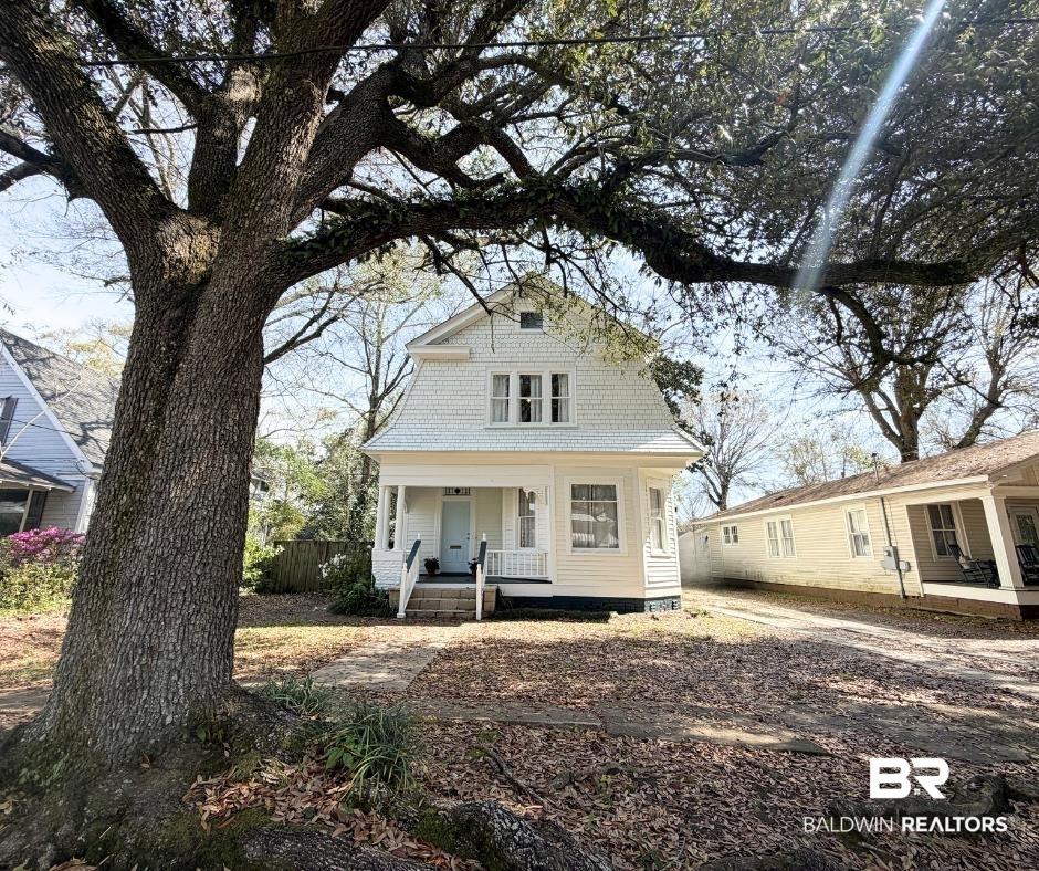 Image 2: Colonial inspired home with a porch