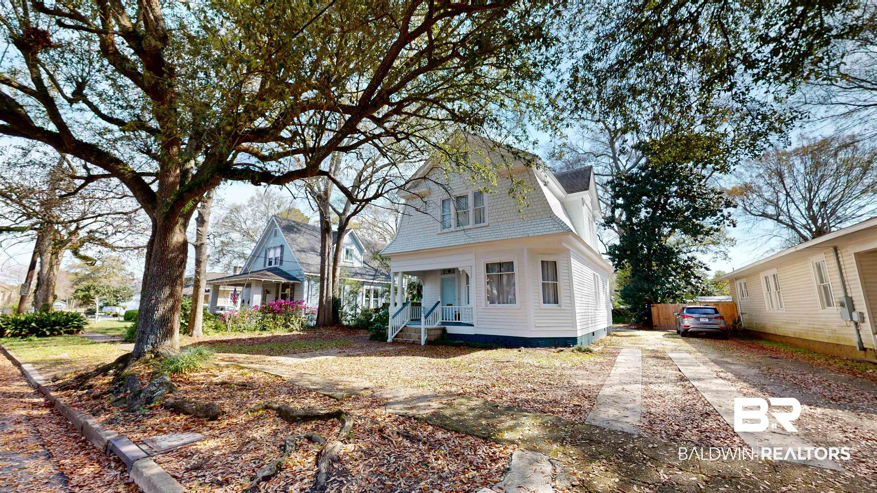 Image 4: View of front of home with a gambrel roof