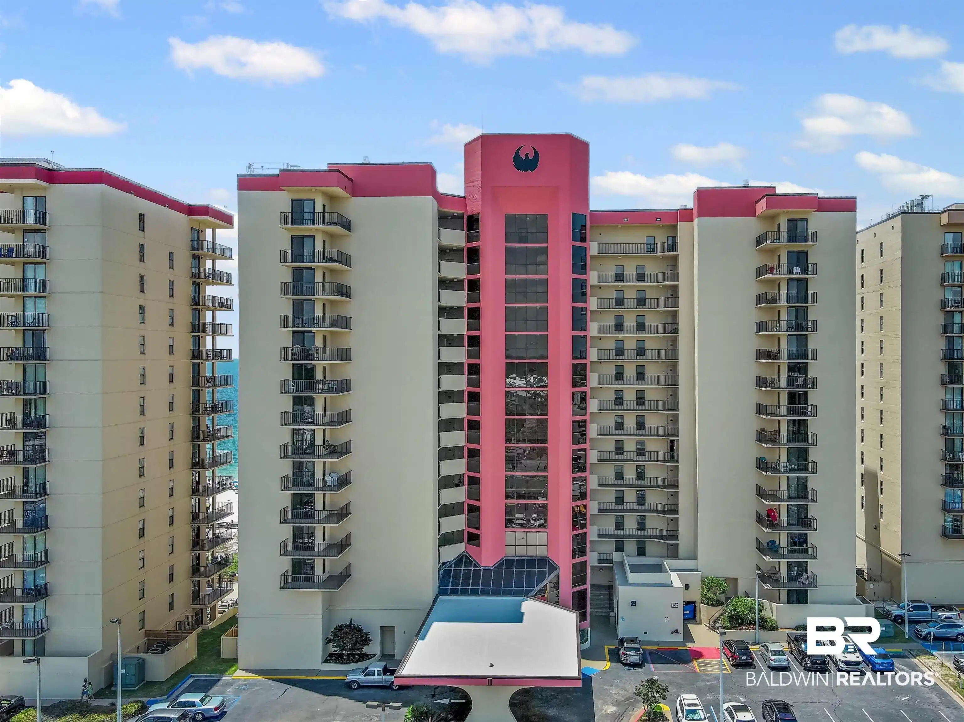 Image 1: View of complex with uncovered parking