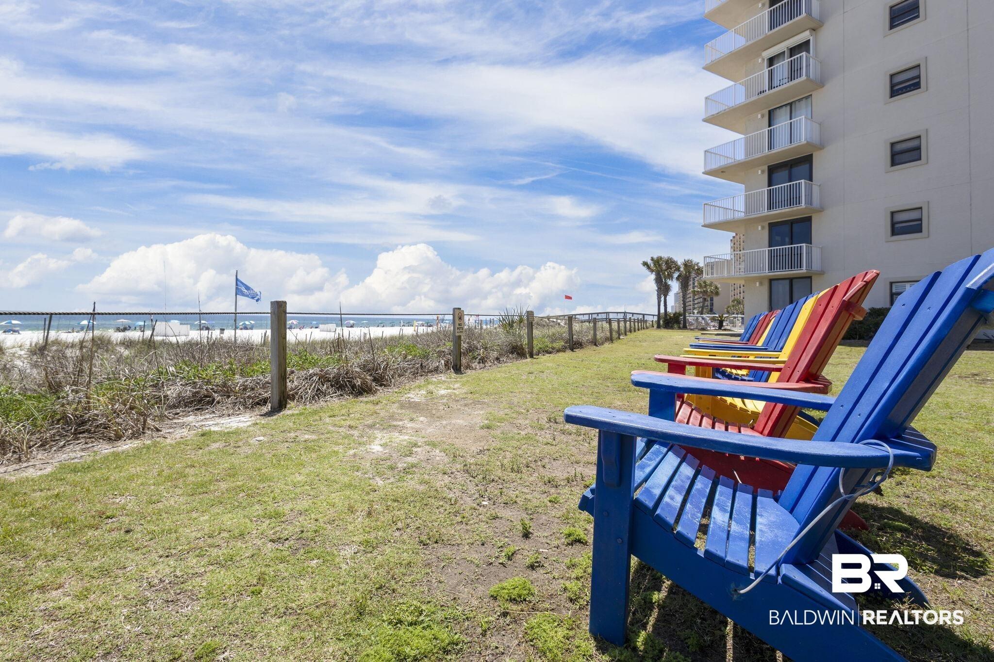 Image 2: View of yard featuring view of water and beach