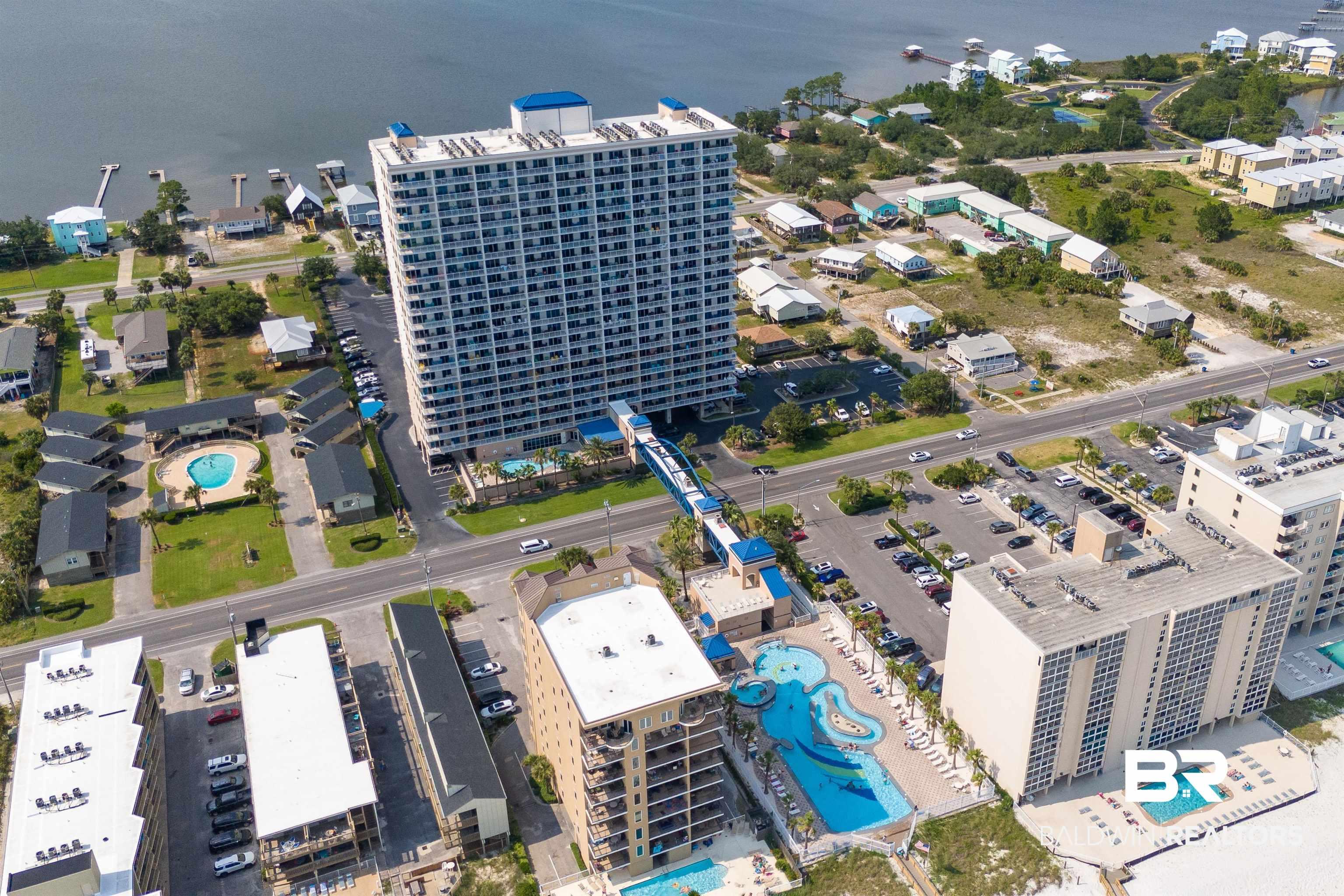 Image 3: This FINE property in Gulf Shores Alabama has so many great resort like amenities.  Multiple pool areas, sky walk to the beach, gulf views and close to all the great spots in Gulf Shores/Orange Beach.