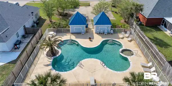 Image 2: Community pool with a patio