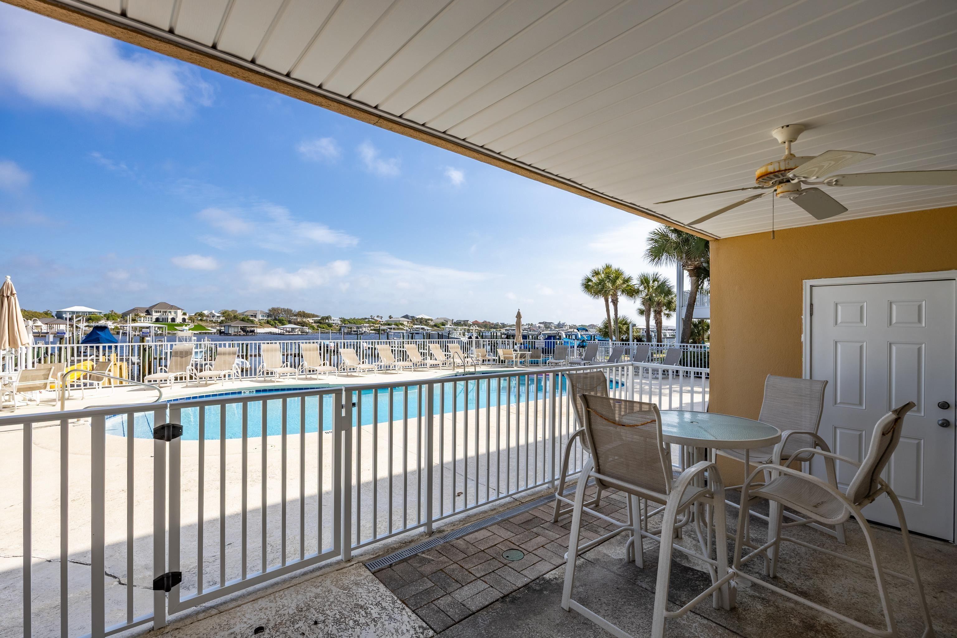 Image 4: Pool featuring a patio area, fence, and a ceiling fan