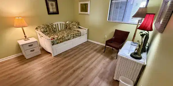 Image 4: Bedroom with baseboards and light wood-type flooring