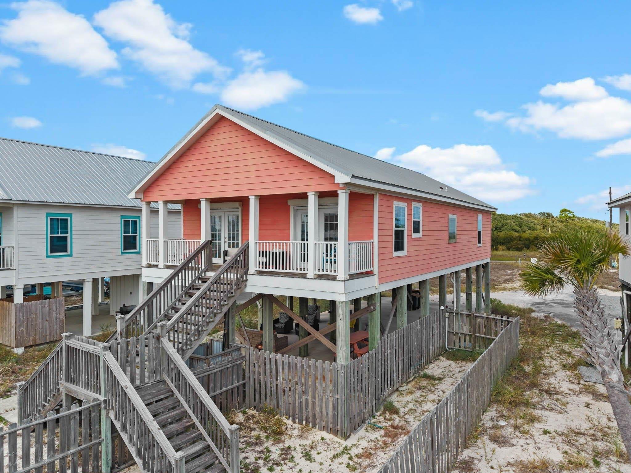 Image 3: Coastal inspired home featuring stairs and french doors