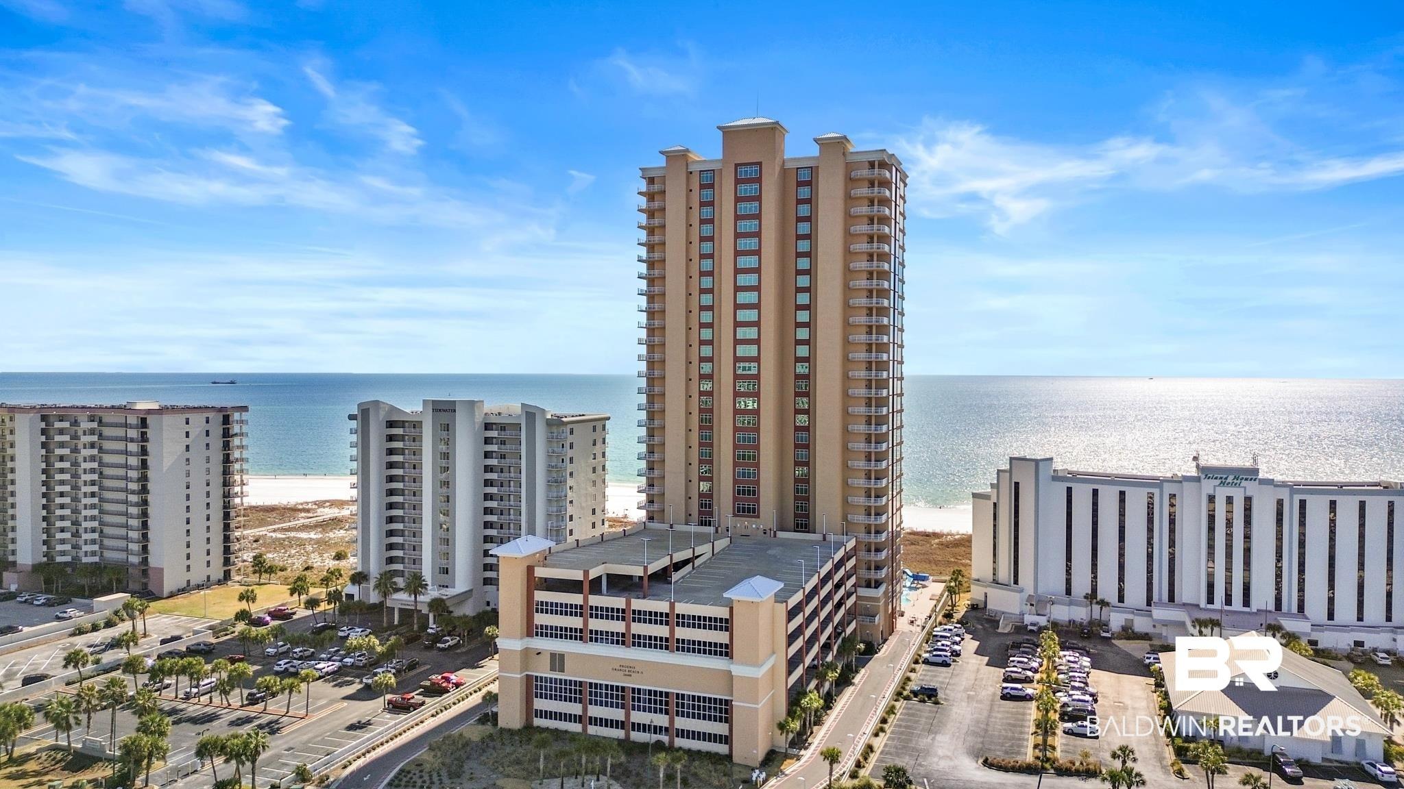 Image 2: Drone / aerial view of a nearby body of water and apartment complex