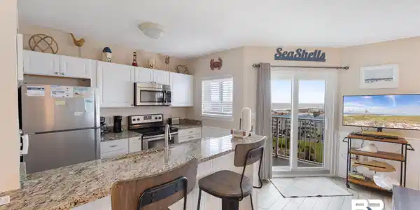 Image 3: View of Kitchen and Living Room