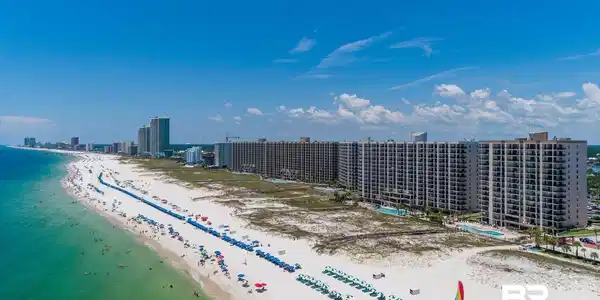 Image 2: Extensive beachfront development featuring multiple high-rise buildings with private balconies