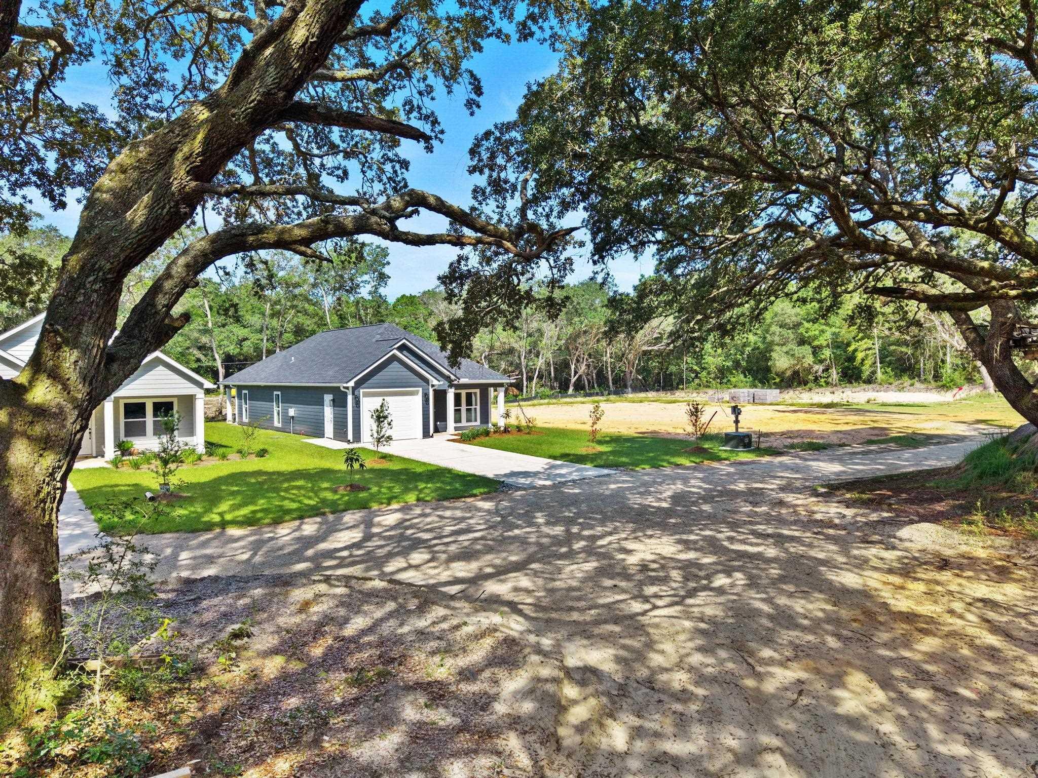 Image 4: Single story home featuring a front yard and driveway