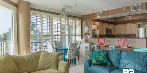 Image 4: Living area featuring light tile patterned flooring