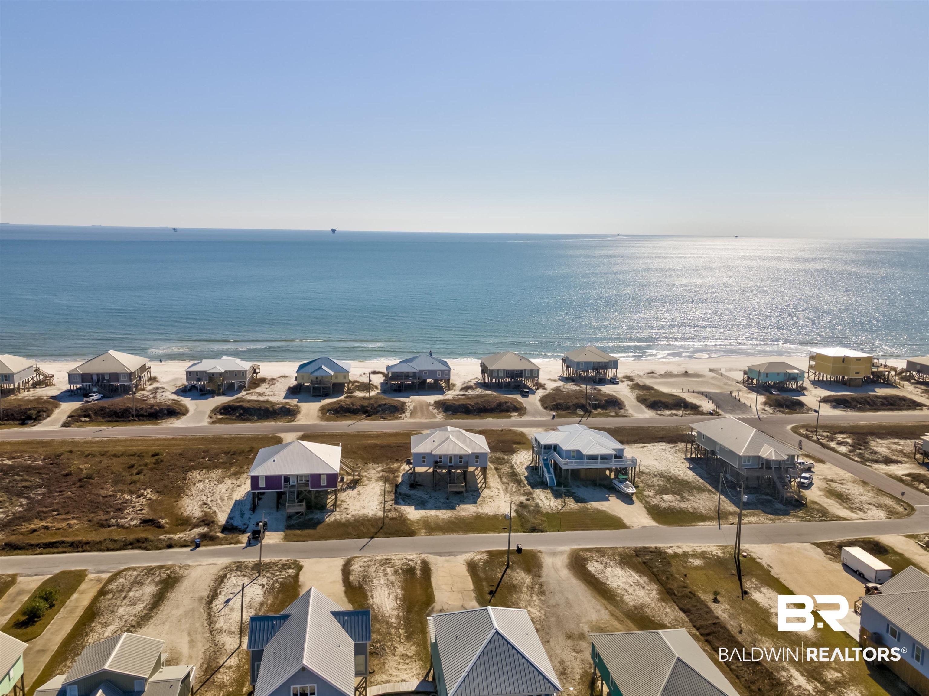 Image 3: Aerial view of residential area with extended coastline