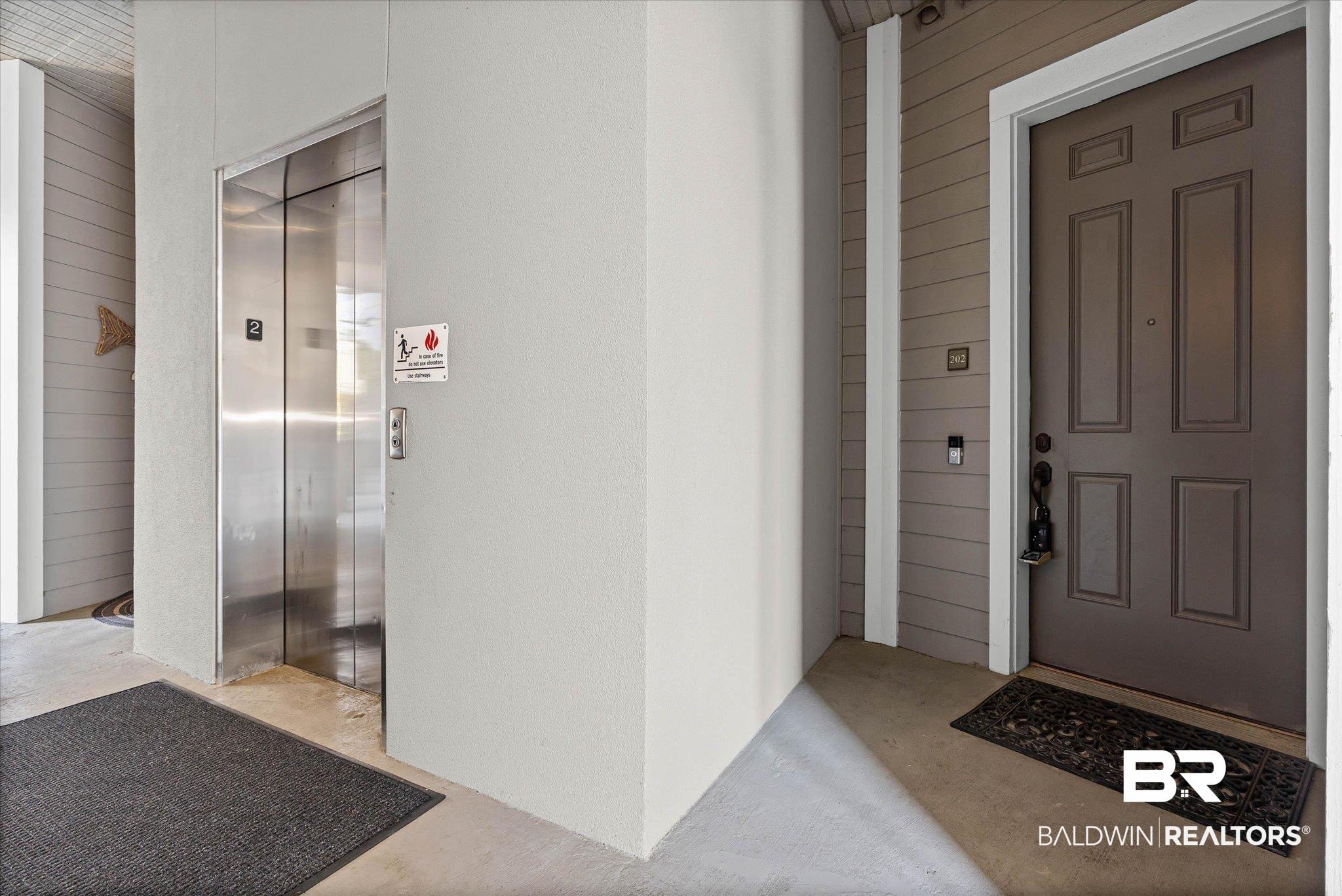 Image 2: Doorway to property featuring elevator