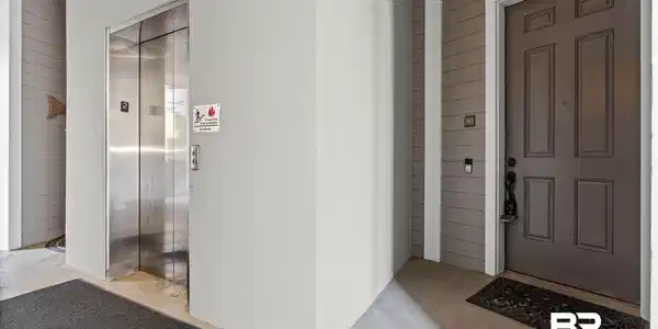 Image 2: Doorway to property featuring elevator