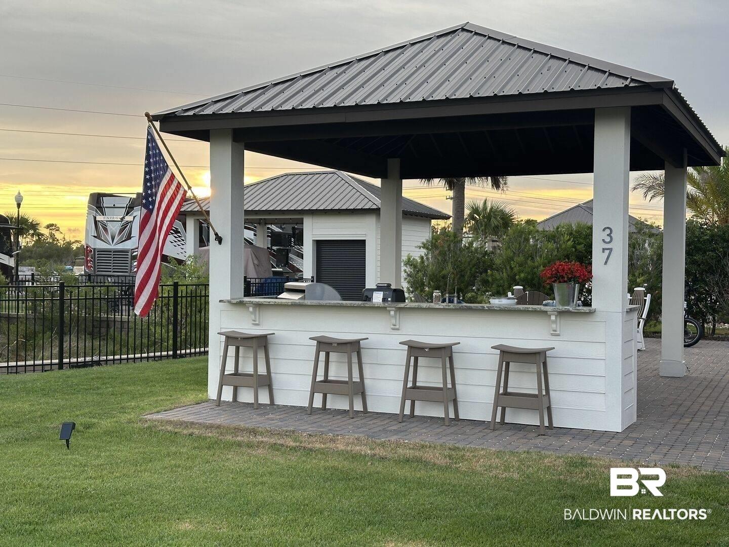 Image 3: View of patio with an outdoor bar