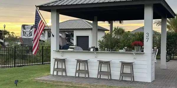 Image 3: View of patio with an outdoor bar