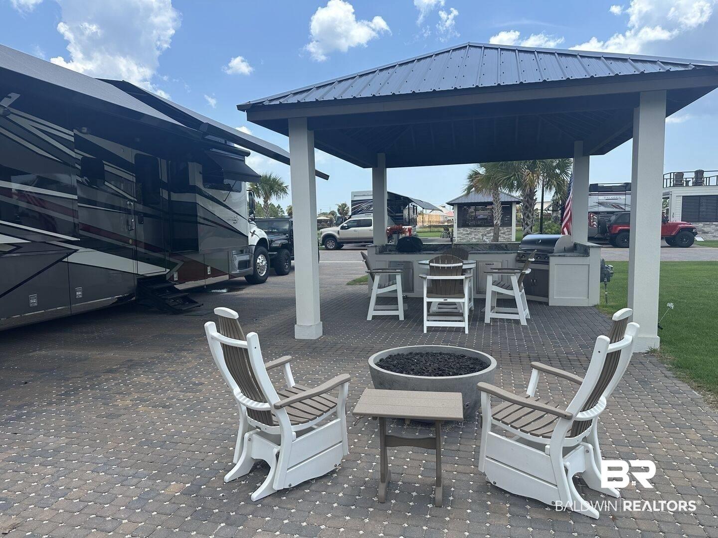 Image 4: View of patio / terrace featuring a fire pit, exterior kitchen, and a gazebo