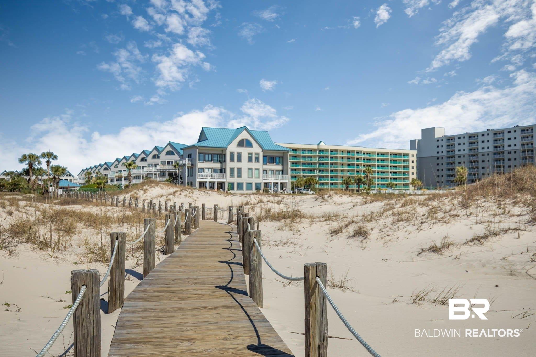 Image 3: Dock area featuring view of water and beach