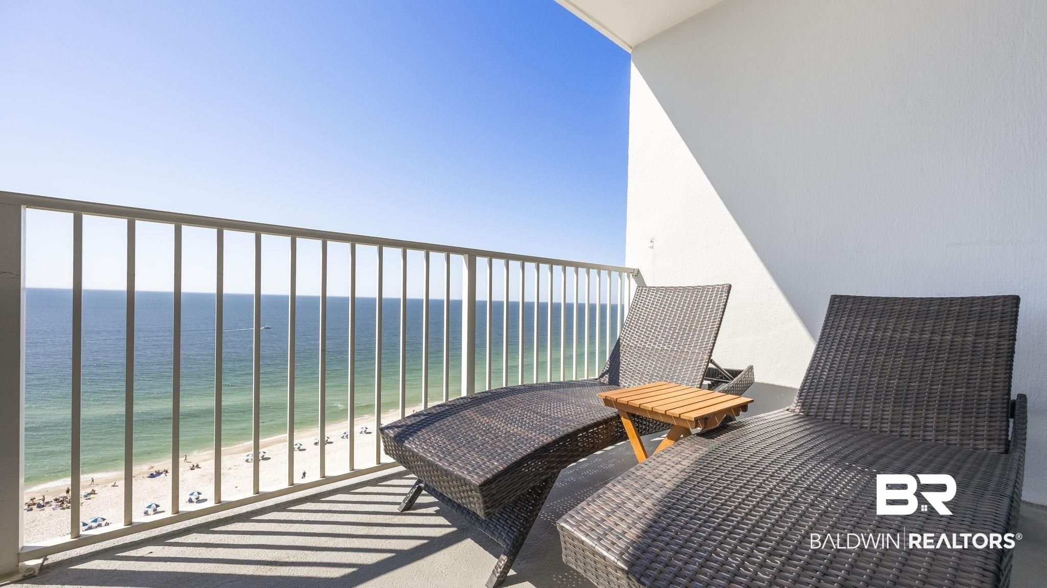 Image 4: Balcony featuring view of water and beach