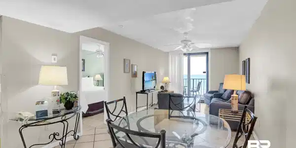 Image 4: Dining area with light tile patterned floors, baseboards, a textured ceiling, and ceiling fan
