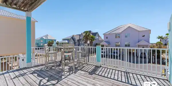 Image 3: Wooden terrace with a residential view