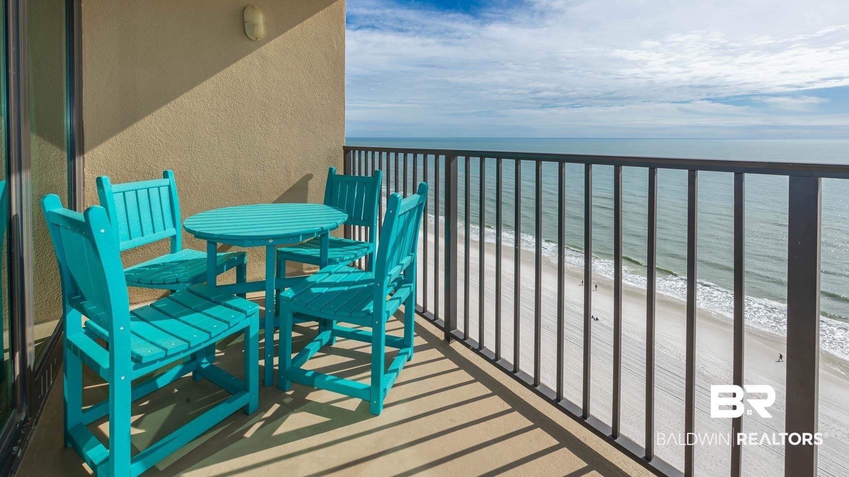 Image 2: Balcony with view of water and beach