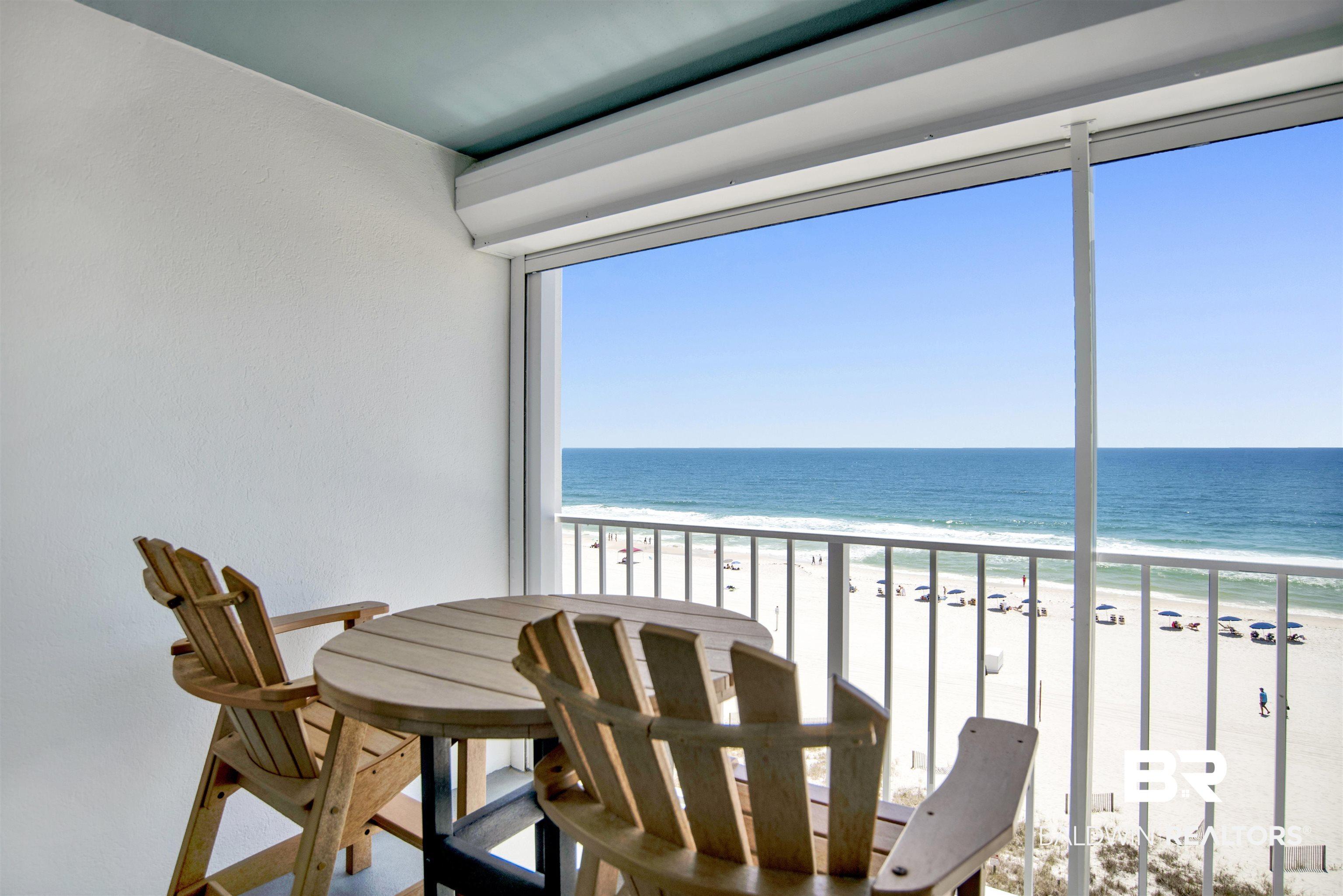 Image 4: Balcony featuring direct ocean frontage with white sand beach