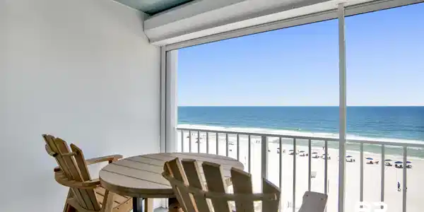 Image 4: Balcony featuring direct ocean frontage with white sand beach