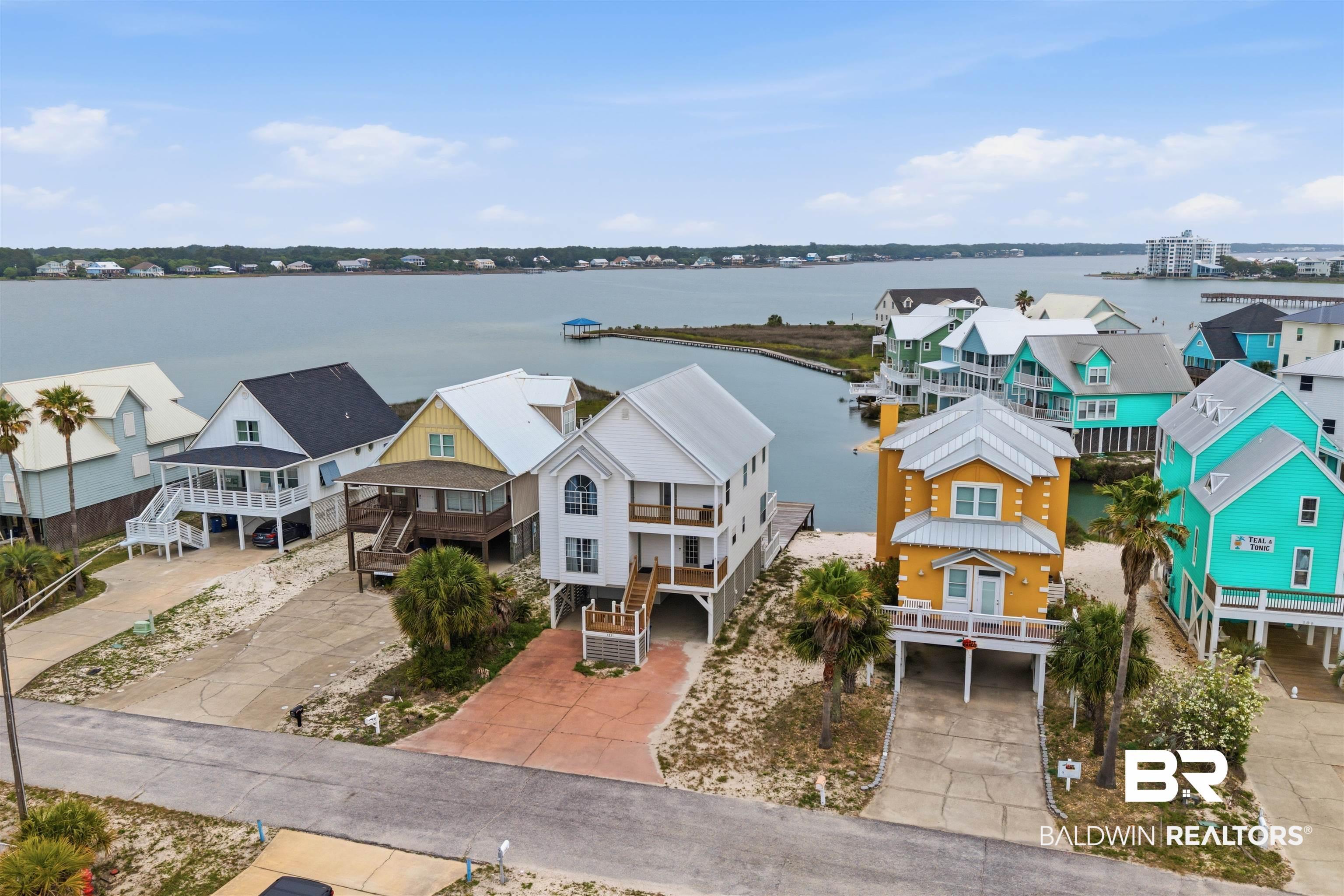 Image 4: Waterfront property featuring multiple residences with direct access to the water