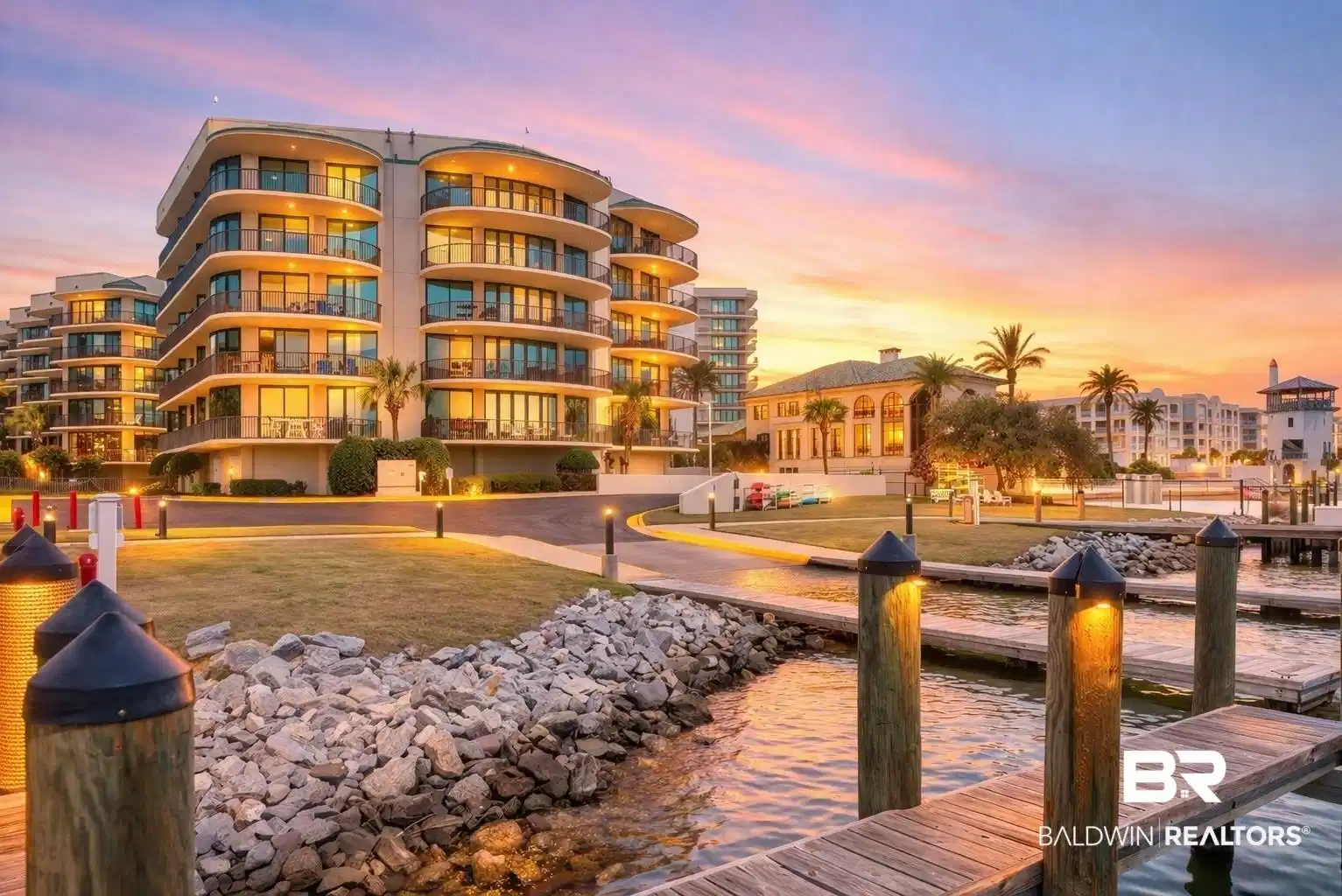Image 1: Property at dusk featuring a water view and a view of apartment building / complex