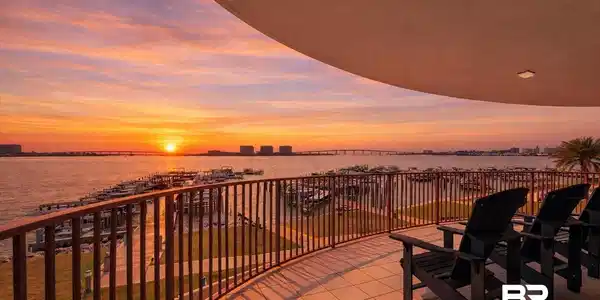 Image 2: Balcony featuring a water view