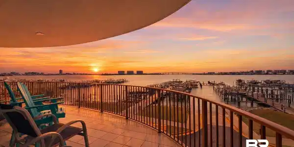 Image 3: Balcony featuring a water view