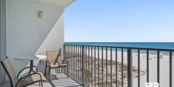 Image 2: Balcony with view of water and beach