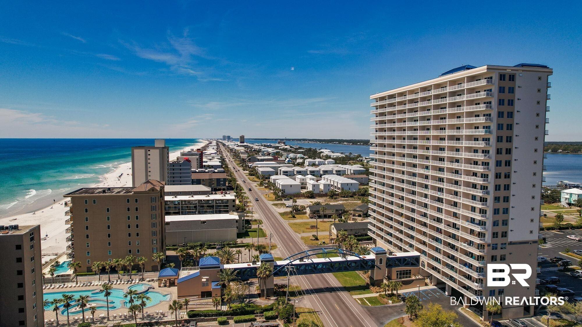 Image 2: High-rise building with numerous balconies facing the coastline