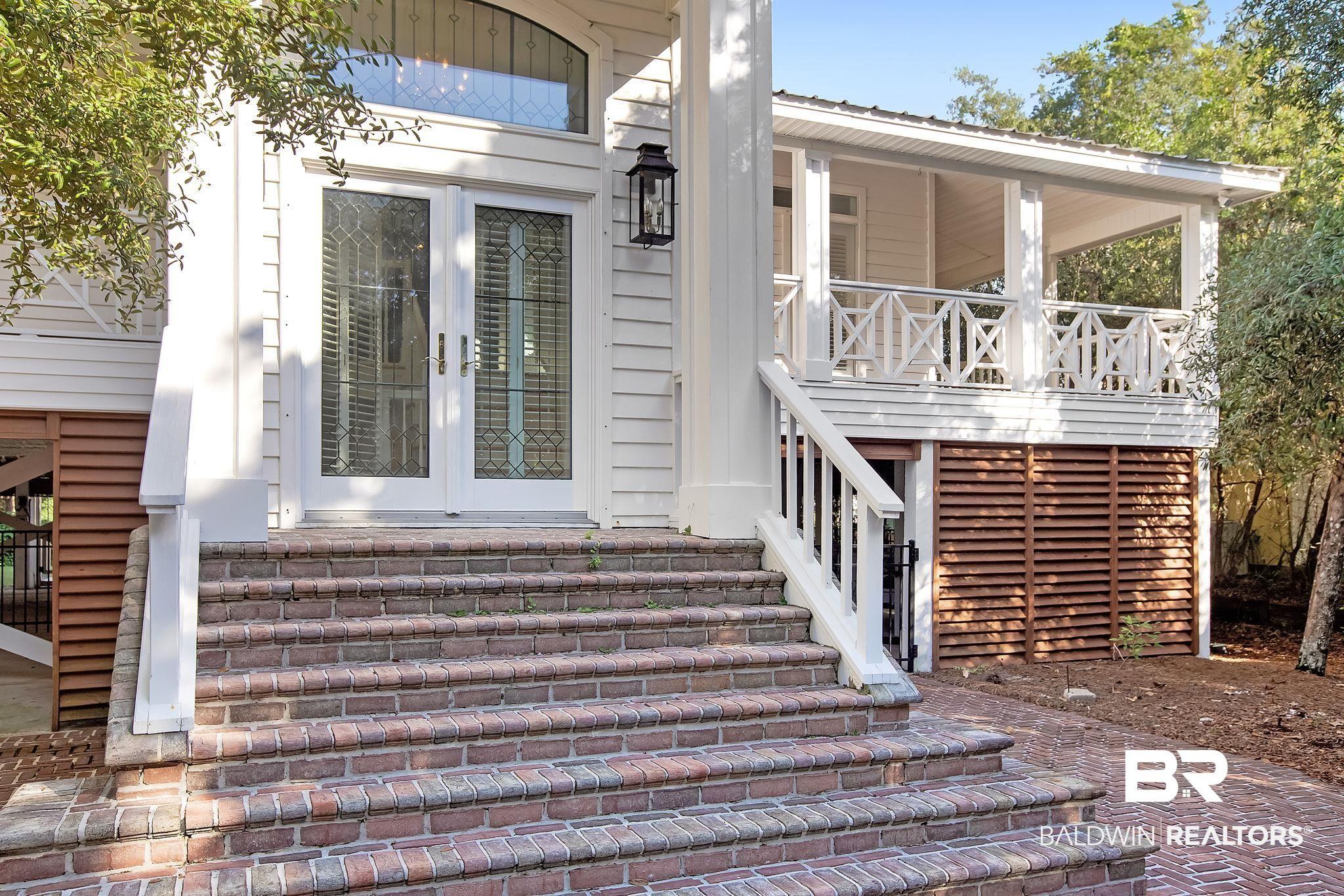 Image 4: Doorway to property with french doors and covered porch