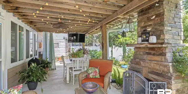 Image 4: View of patio featuring an outdoor living space with a fireplace