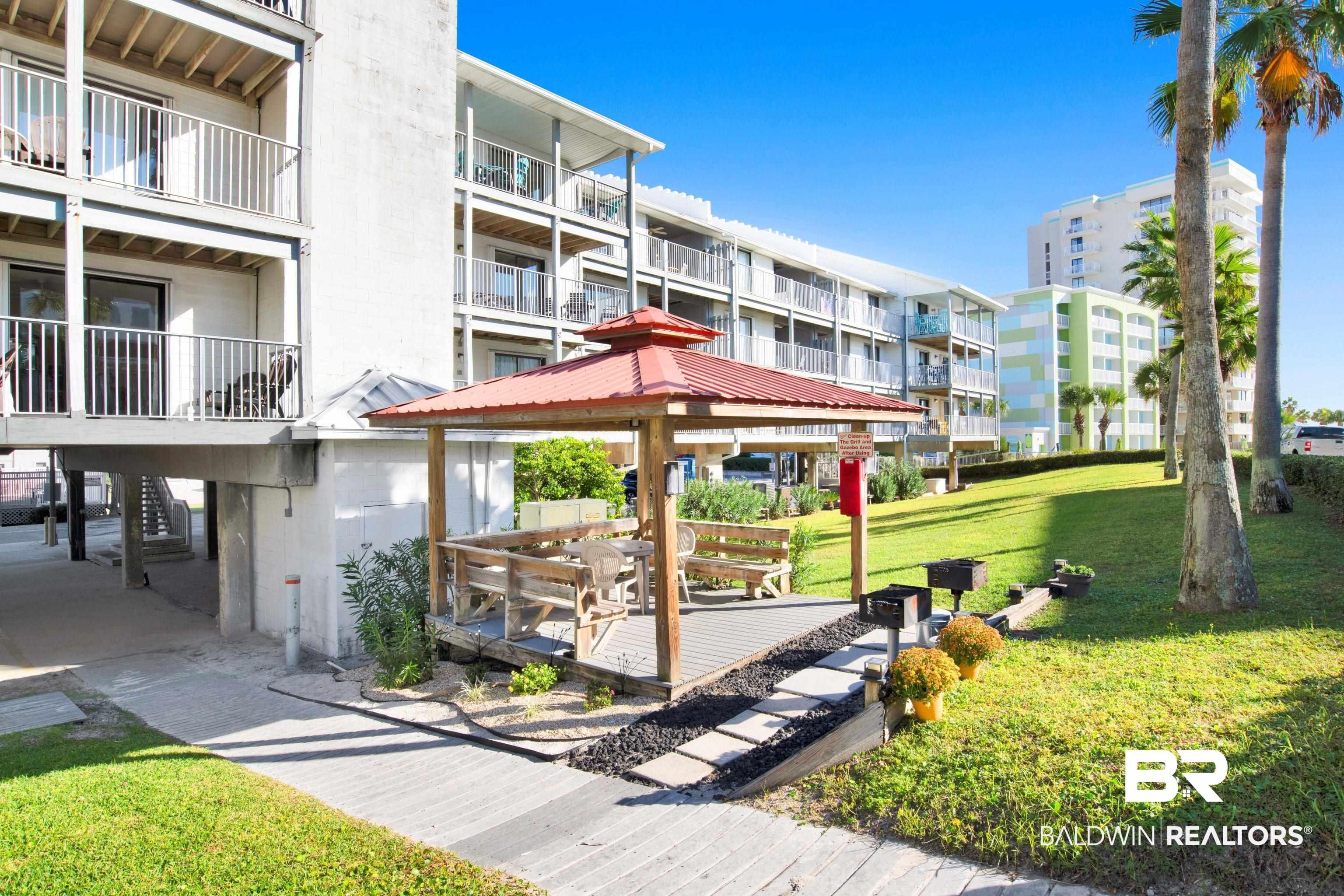 Image 3: Surrounding community featuring a gazebo and a lawn