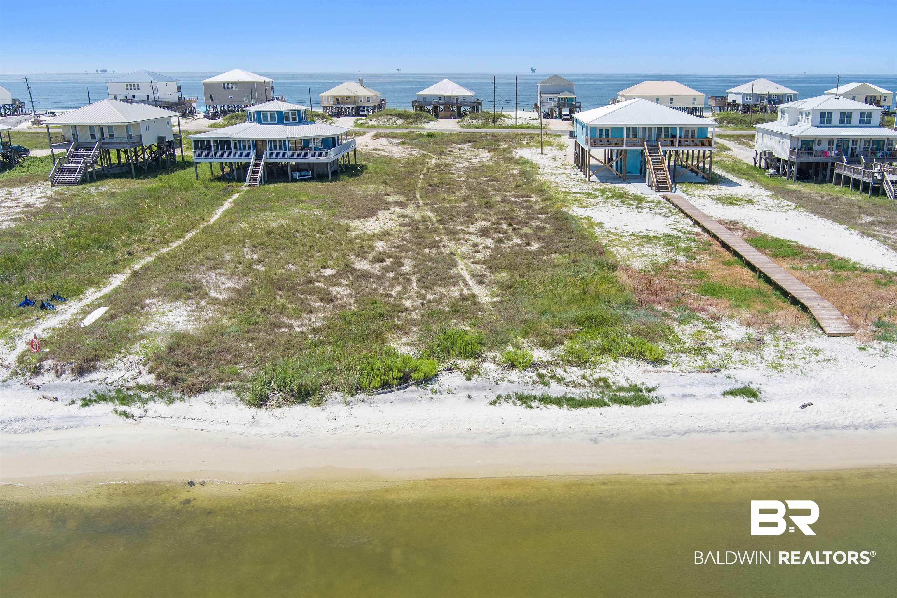 Image 4: Aerial view featuring a water view and a beach view