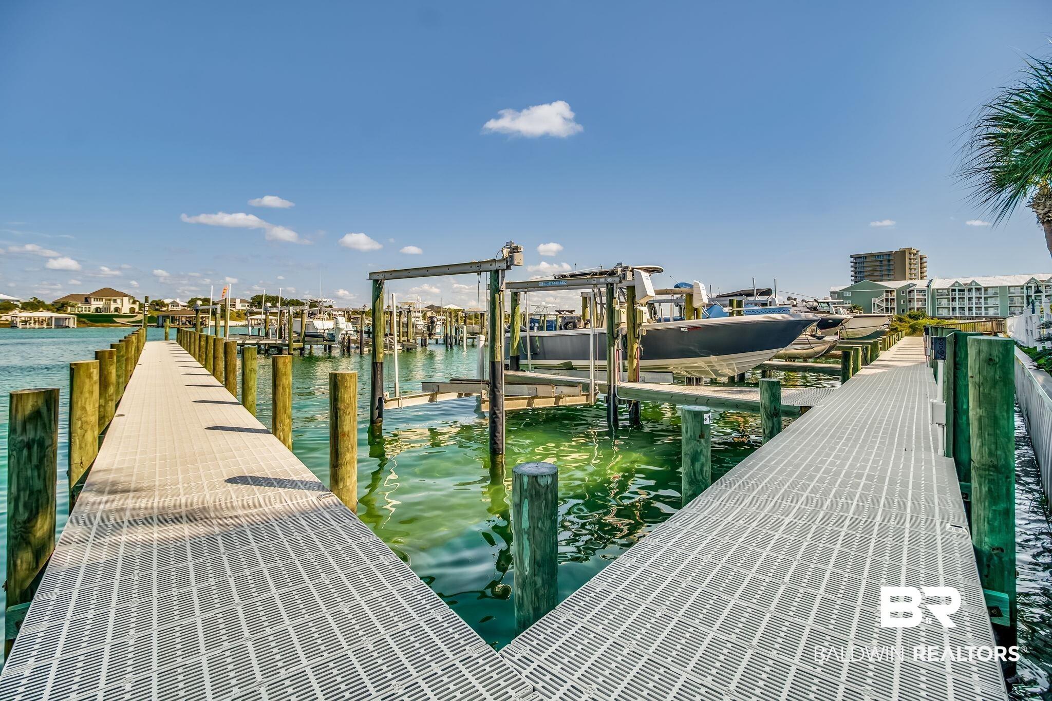 Image 2: Dock with boat lift and a water view